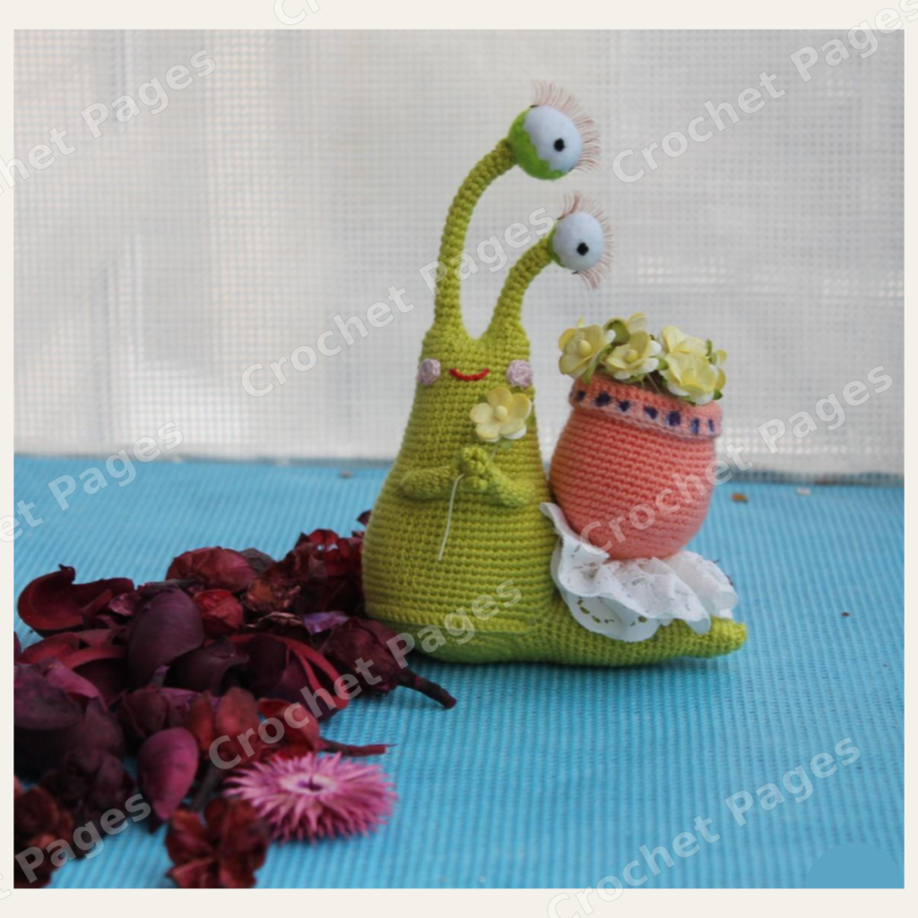 Rita the Snail finished crochet project shown in the actual pattern photographs