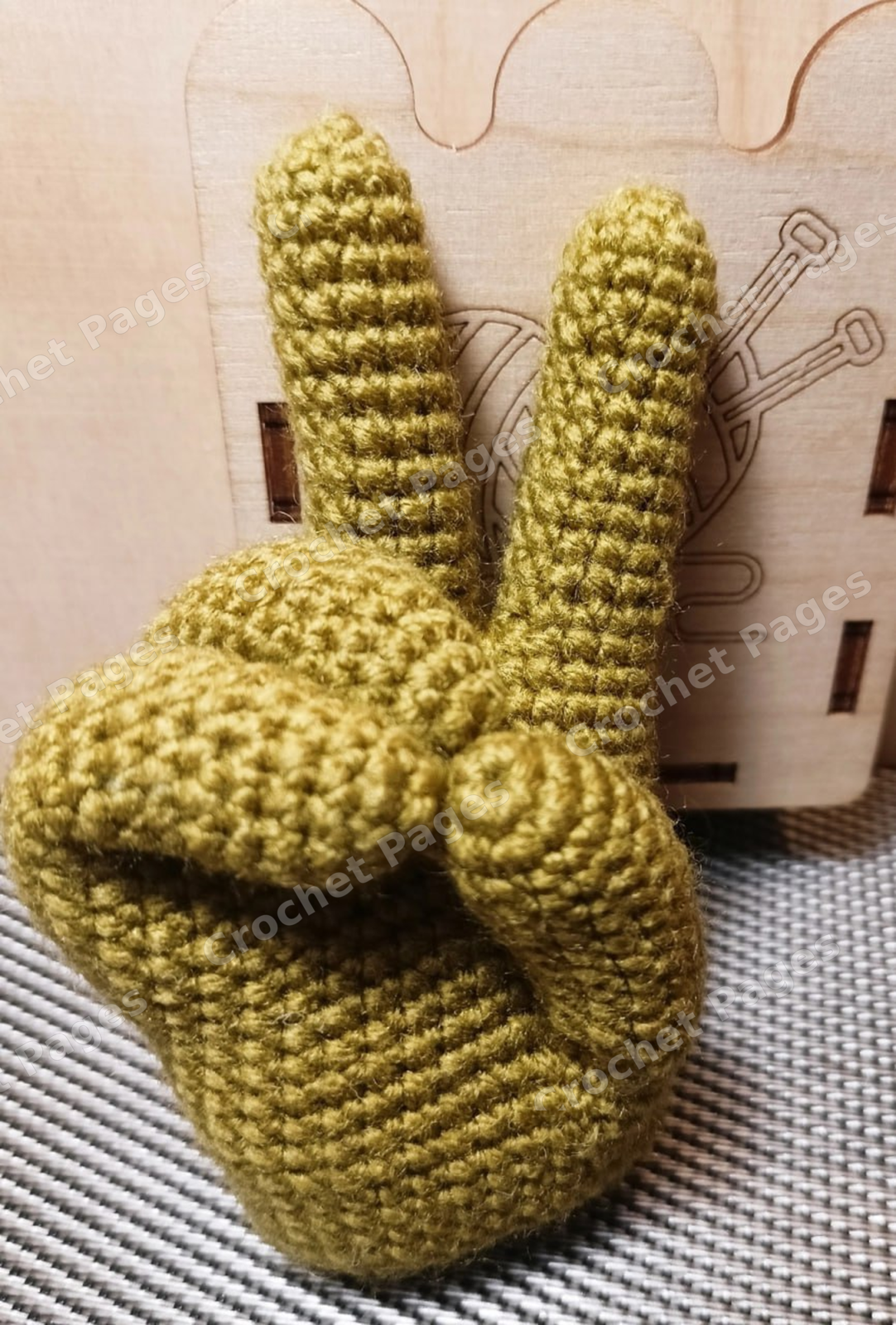 Hand Keychain crochet project shown in the pattern preview
